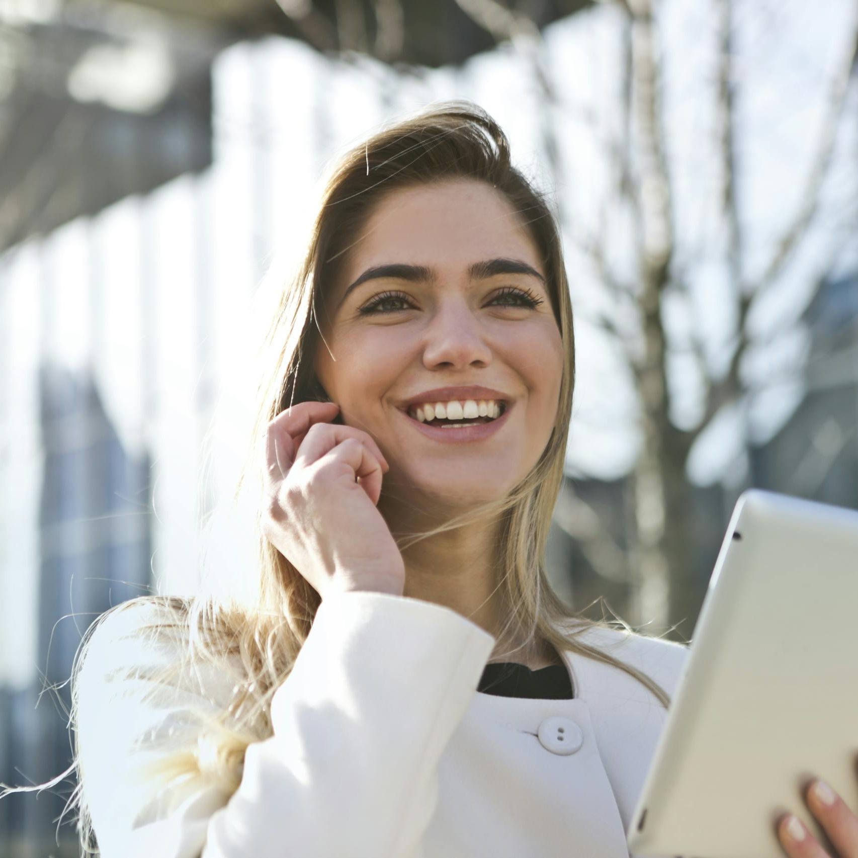 Woman In White Blazer Holding Tablet Computer